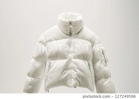 Blank template white down jacket with zipped, front view isolated on white background. Mockup winter jacket for design. Warm Puffer Hanging On Wall. Fashion clothes. Fall apparel. Modern youth style. 127249506