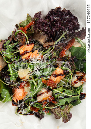 Portion of gourmet seafood salad with greens 127249665