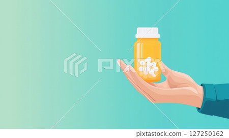 Hand holding pill bottle on teal background. Hand holding pill bottle on teal background. 127250162