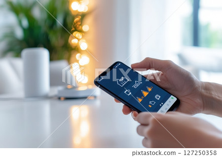 Smart home control woman using mobile app for home automation 127250358