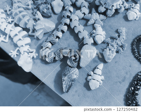 Art objects printed on a 3D printer. Various creative models created on a 3D printer from molten plastic. Concept 3D Printing. New modern 3D Printing additive technology. Blue color 127250482