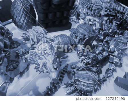 Art objects printed on a 3D printer. Various creative models created on a 3D printer from molten plastic. Concept 3D Printing. New modern 3D Printing additive technology. Blue color 127250490