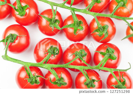 Branches of fresh cherry tomatoes isolated on white 127251298