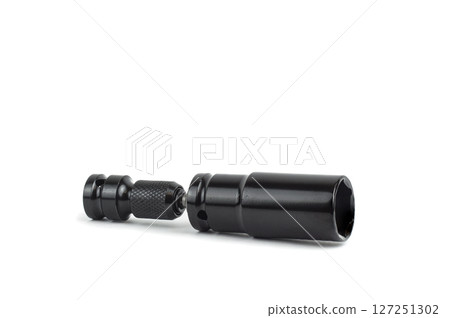 A ratchet and a set of interchangeable heads for a chrome-plated socket wrench. Isolated on a white background 127251302