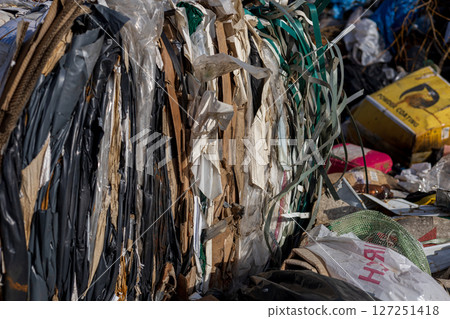 A landfill site showcases layers of compacted waste, highlighting the ongoing issues of pollution and the challenges in effective waste management A landfill site showcases layers of compacted waste, highlighting the ongoing issues of pollution and the challenges in effective waste management 127251418