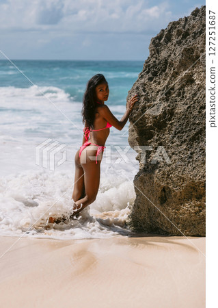 Beauty woman in bikini swimwear enjoying on sunny beach Beauty woman in bikini swimwear enjoying on sunny beach 127251687