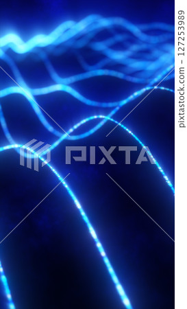 Flowing glowing blue lines on a dark background, representing digital currents or wave energy 127253989