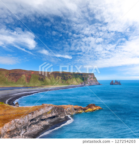 Impressive View of Kirkjufjara black sand beach from Dyrholaey promontory on Atlantic South Coast Impressive View of Kirkjufjara black sand beach from Dyrholaey promontory on Atlantic South Coast 127254203