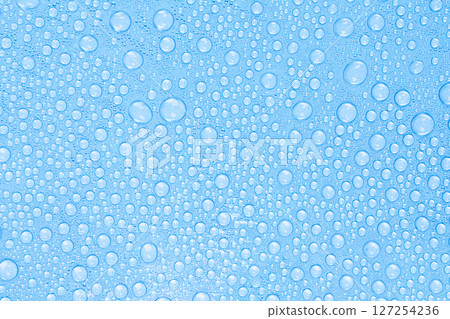 Water Drops on Blue Surface. Freshness and Clean Texture Background. Stock photo. Water Drops on Blue Surface. Freshness and Clean Texture Background. Stock photo. 127254236