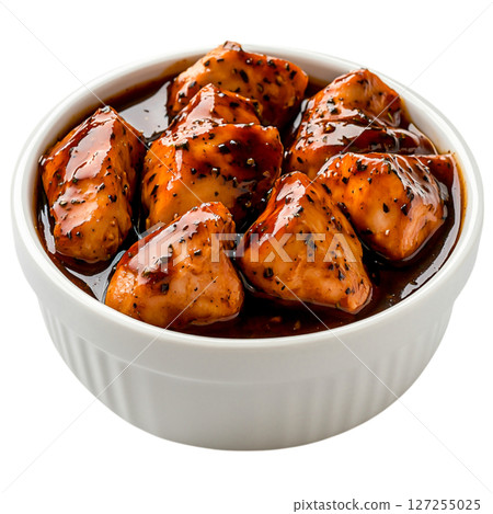 Delicious Glazed Chicken Pieces in White Bowl Full of Flavorful Sauce 127255025