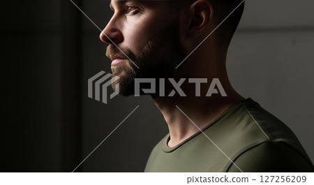 Man with beard in profile, olive shirt Man with beard in profile, olive shirt 127256209