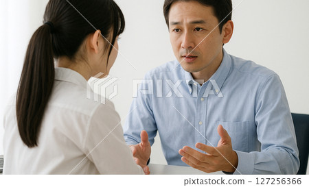 A man talking enthusiastically 127256366