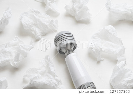 Massager and tissues on the sheets Massager and tissues on the sheets 127257563