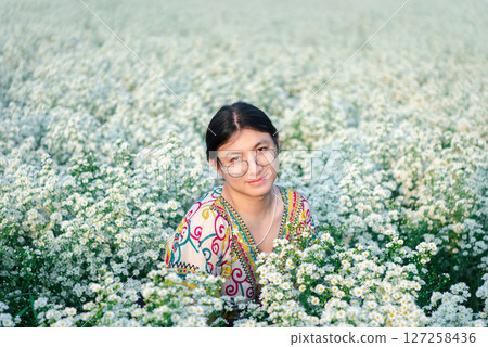 Woman (LGBTQ) posing at flower park garden field 127258436