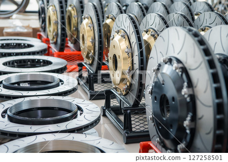 Checking car brake system for repair at car garage Checking car brake system for repair at car garage 127258501
