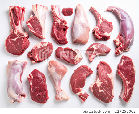 AI generated top view of fresh raw goat meat cut into pieces from various cuts arranged neatly showcasing natural color and texture against clean white background AI generated top view of fresh raw goat meat cut into pieces from various cuts arranged neatly showcasing natural color and texture against clean white background 127259062