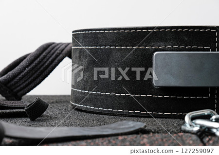 Power belt on gym mat 127259097