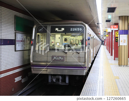 Osaka Metro 22 series train stopping at Fuminosato Station on the Tanimachi Line 127260665
