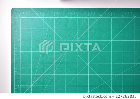 green cutting mat board on white background with line and scale measure guide pattern for art design green cutting mat board on white background with line and scale measure guide pattern for art design 127262835