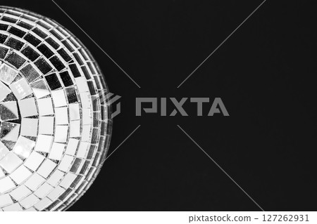 Dusty disco ball made from glass isolated on black background surface Dusty disco ball made from glass isolated on black background surface 127262931