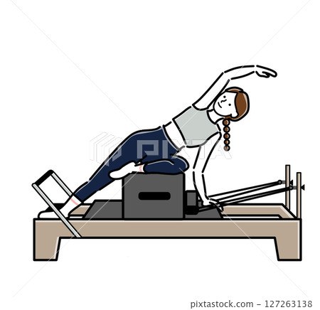 A woman stretching her side with machine pilates A woman stretching her side with machine pilates 127263138