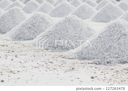 Sea salt piles in evaporation pond in Thailand Sea salt piles in evaporation pond in Thailand 127263478