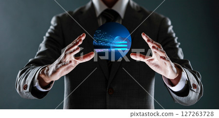 businessman holding a sphere with a globe in his hands. 127263728