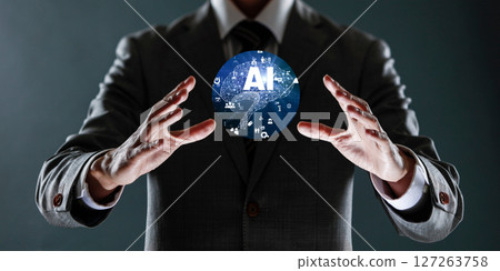 businessman holding a sphere with a globe in his hands. 127263758