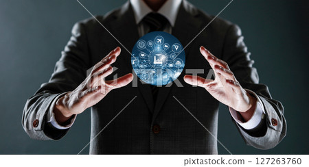 businessman holding a sphere with a globe in his hands. businessman holding a sphere with a globe in his hands. 127263760