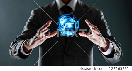 businessman holding a sphere with a globe in his hands. 127263785