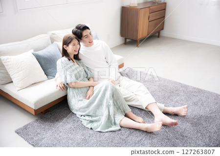 A bird's-eye view of a couple relaxing in the living room 127263807