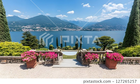 Picturesque Lake Como vista from idyllic gardens with mountains backdrop 127265257