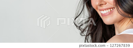 Closeup of woman smiling with perfect white teeth Closeup of woman smiling with perfect white teeth 127267839
