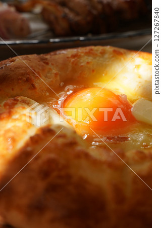 Traditional Georgian dish Khachapuri Adjaruli with egg and cheese Traditional Georgian dish Khachapuri Adjaruli with egg and cheese 127267840