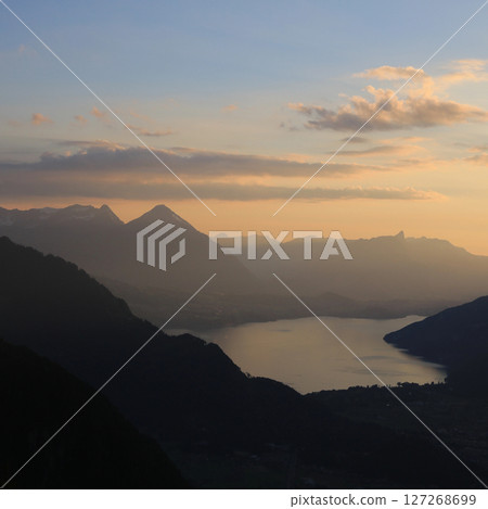 Golden evening sky over Lake Thun and Mt Niesen, Switzerland. Golden evening sky over Lake Thun and Mt Niesen, Switzerland. 127268699