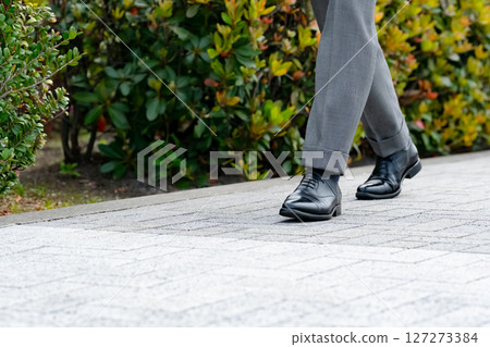 Businessman walking feet Businessman walking feet 127273384