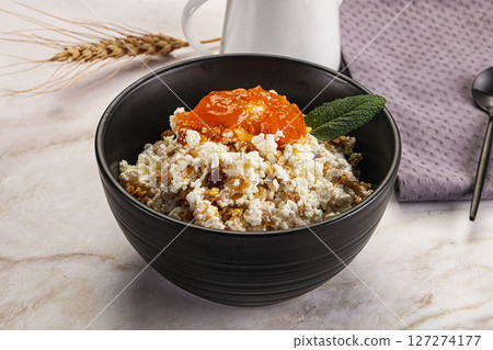 Curd with granola and orange jam Curd with granola and orange jam 127274177