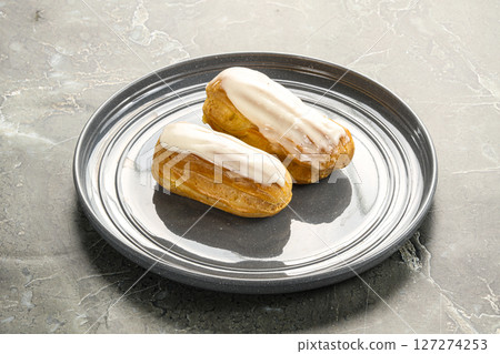 Delicous eclair with ising and cream Delicous eclair with ising and cream 127274253