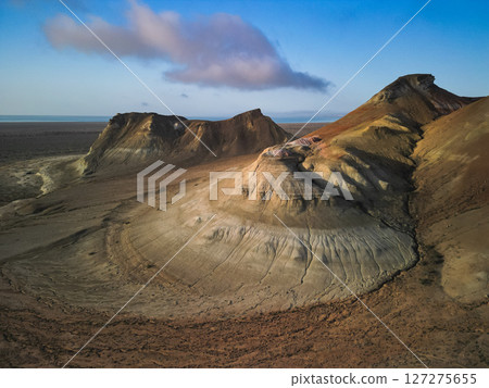 Vivid desert sunrise at Aktumsuk cape near the Aral Sea, Karakalpakstan Vivid desert sunrise at Aktumsuk cape near the Aral Sea, Karakalpakstan 127275655