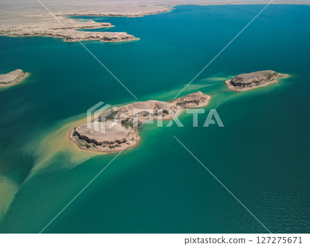 Long island and clear blue waters of reservoir seen from above in Uzbekistan Long island and clear blue waters of reservoir seen from above in Uzbekistan 127275671