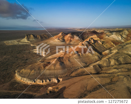 Aerial view of Aktumsik Cape's unique mound with visible layers and eroded base Aerial view of Aktumsik Cape's unique mound with visible layers and eroded base 127275672