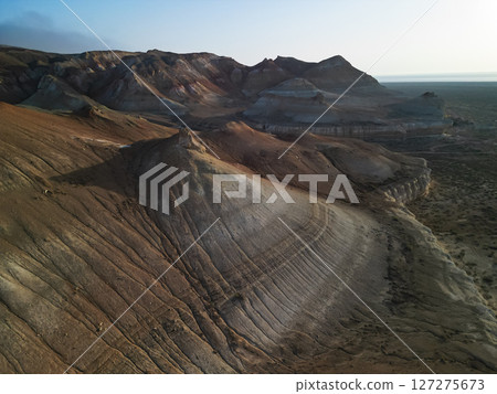 Aerial view over ancient Aktumsuk formations in Karakalpakstan, Uzbekistan, dawn 127275673