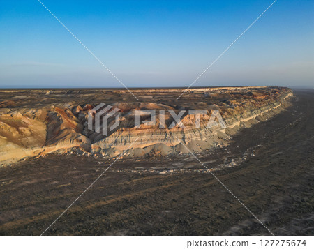 Aerial view of eroded ravines and ochre hills in Uzbekistan 127275674