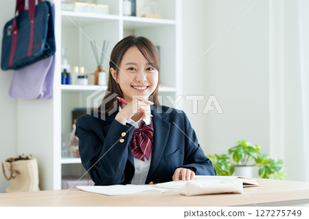 High school girl studying at home 127275749