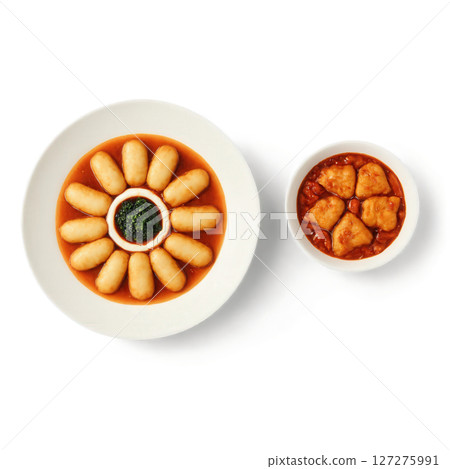 Tteokbokki - Spicy rice cakes stir-fried in a sweet, savory, and spicy sauce made with gochujang and fish cakes. Tteokbokki - Spicy rice cakes stir-fried in a sweet, savory, and spicy sauce made with gochujang and fish cakes. 127275991