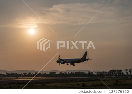 Sendai Airport at dusk, airplane landing, Natori City, Miyagi Prefecture Sendai Airport at dusk, airplane landing, Natori City, Miyagi Prefecture 127276560