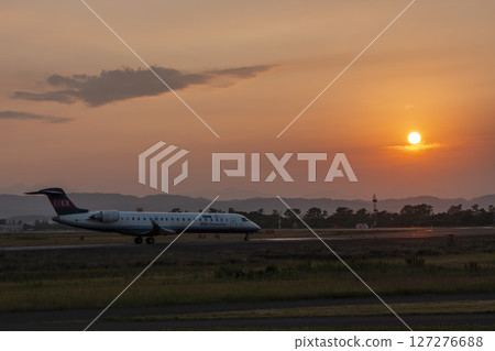 Sendai Airport at dusk, airplane taking off, Natori City, Miyagi Prefecture 127276688
