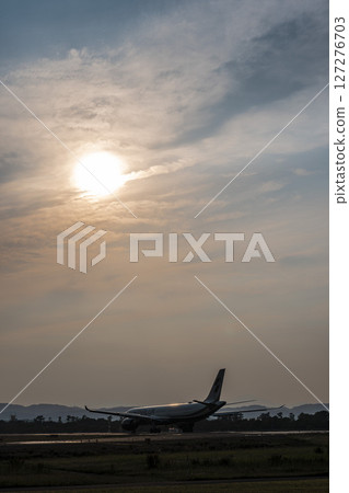 Sendai Airport at dusk, airplane taking off, Natori City, Miyagi Prefecture 127276703