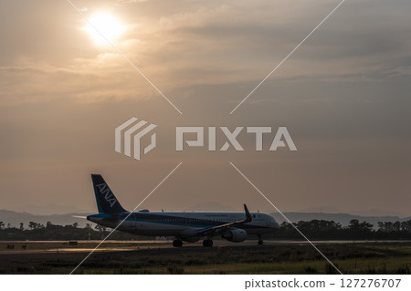 Sendai Airport at dusk, airplane taking off, Natori City, Miyagi Prefecture 127276707