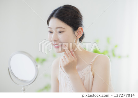 A young woman doing skin care A young woman doing skin care 127277014